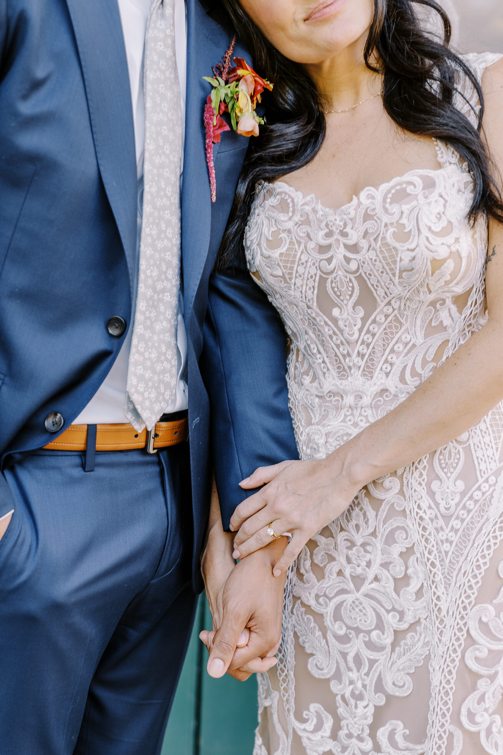 a bride and groom embrace each other for portraits at their midtown Sacramento wedding photographed by Sacramento wedding photographer