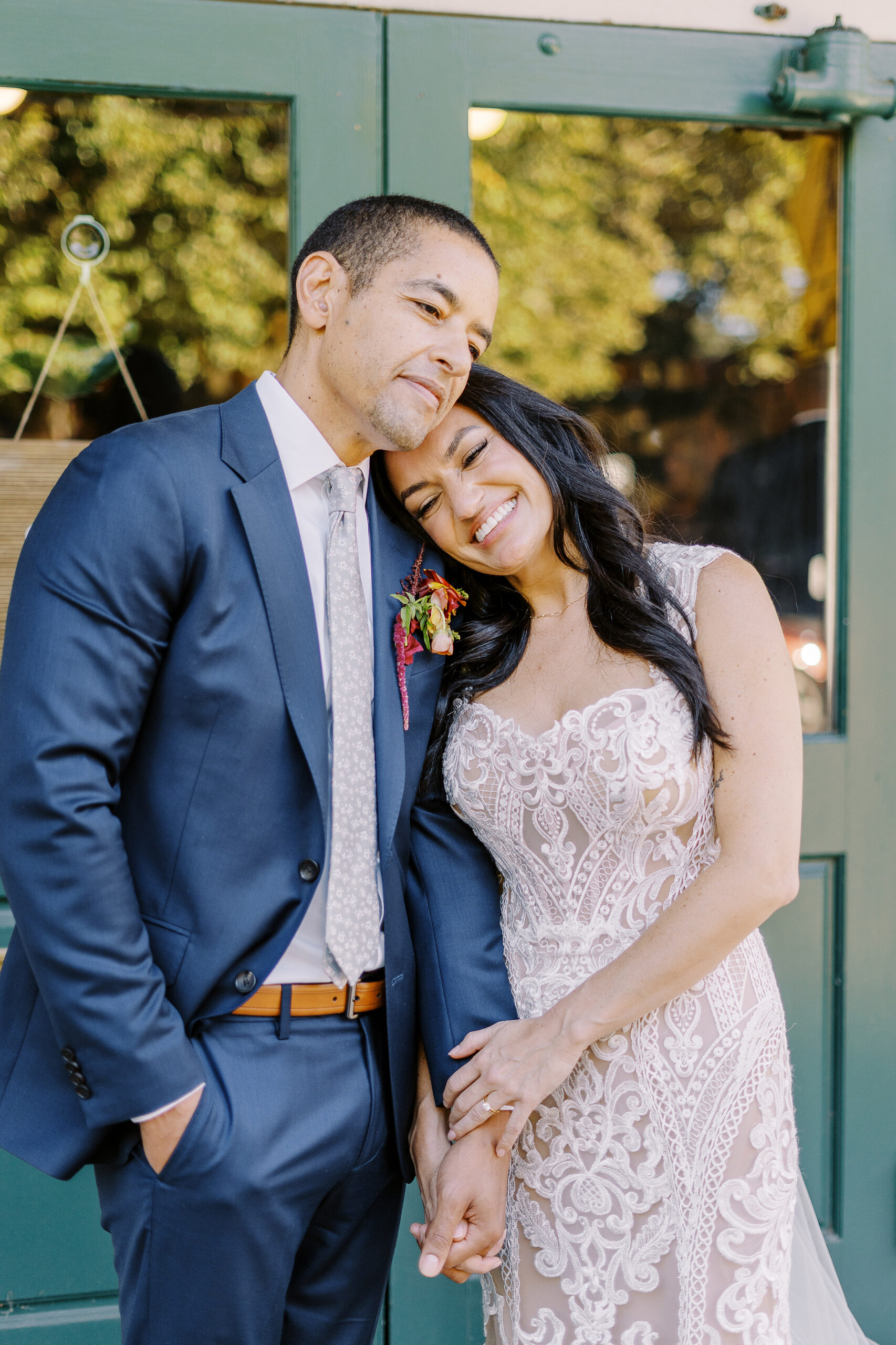 a bride and groom rest their heads together at their midtown Sacramento wedding photographed by Sacramento wedding photographer