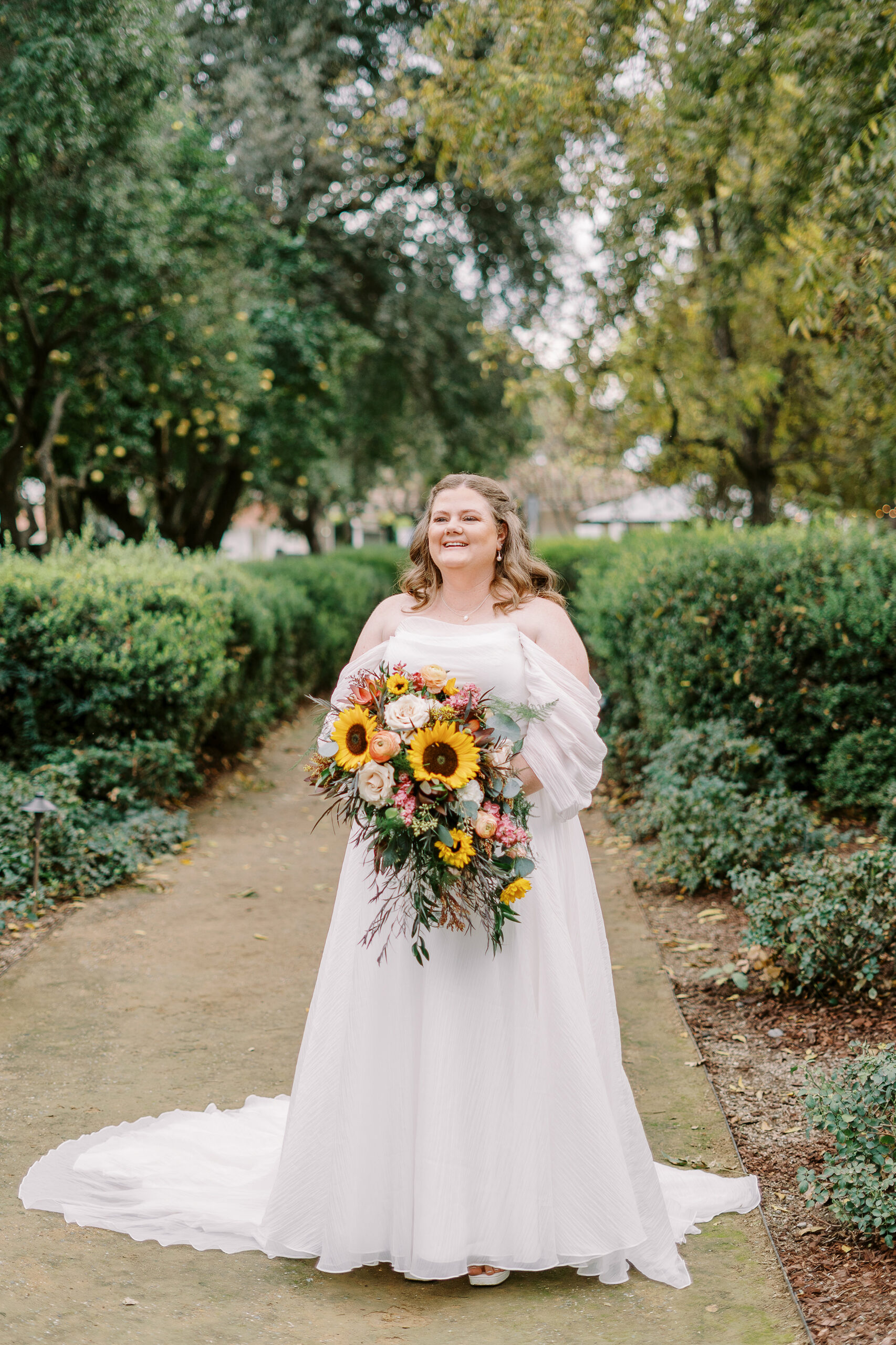 a bride poses for portraits at The Maples Woodland photographed by Sacramento wedding photographer