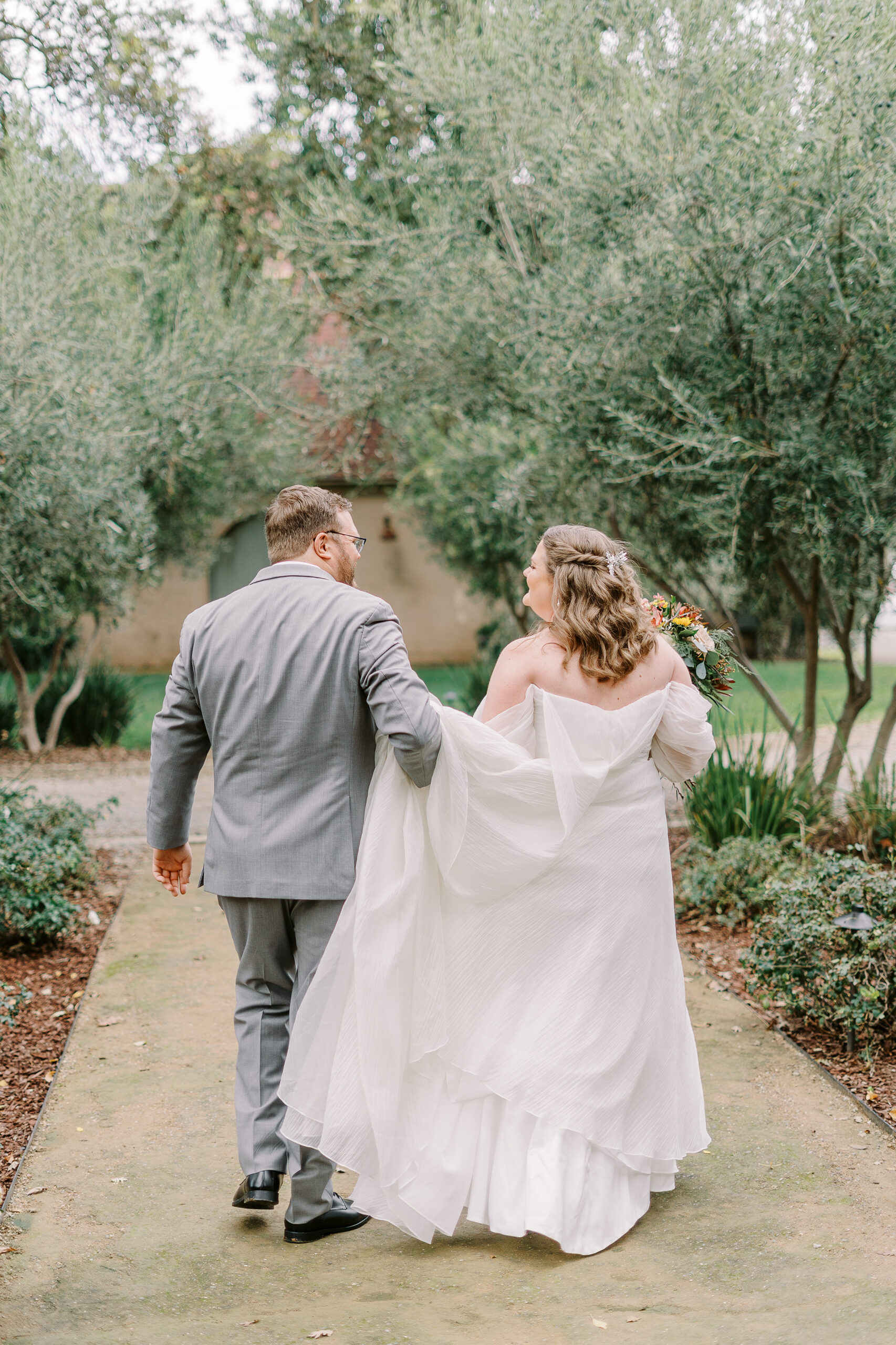 bride and groom portraits in front of the stables at The Maples Woodland photographed by Sacramento wedding photographer