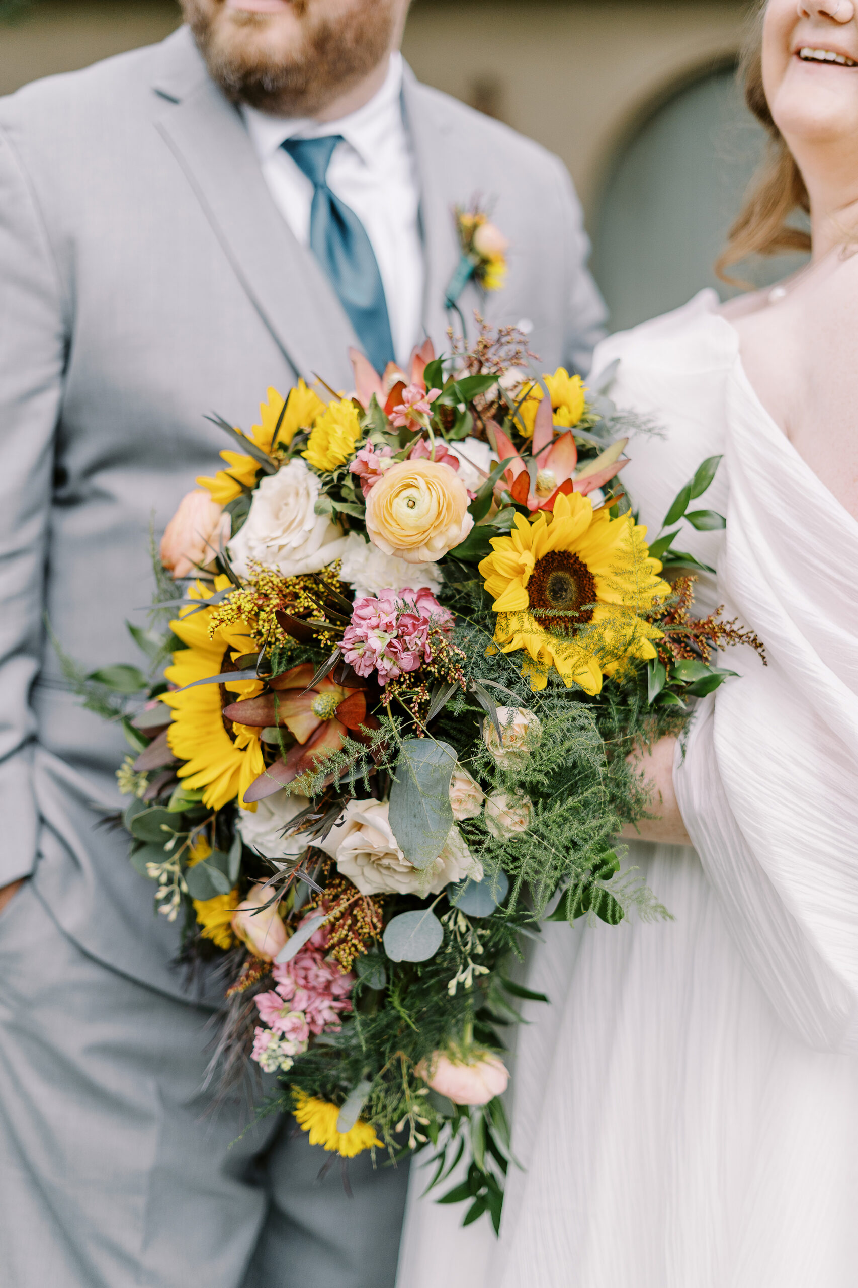 bride and groom portraits in front of the stables at The Maples Woodland photographed by Sacramento wedding photographer