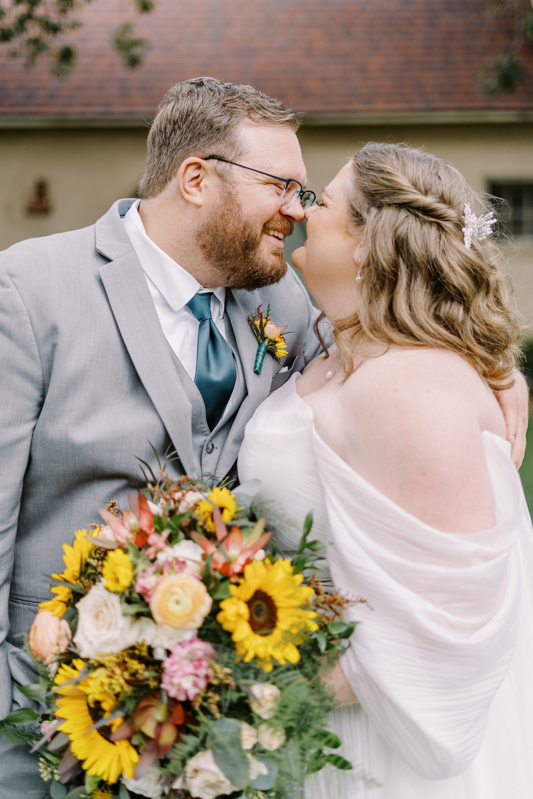 bride and groom portraits in front of the stables at The Maples Woodland photographed by Sacramento wedding photographer