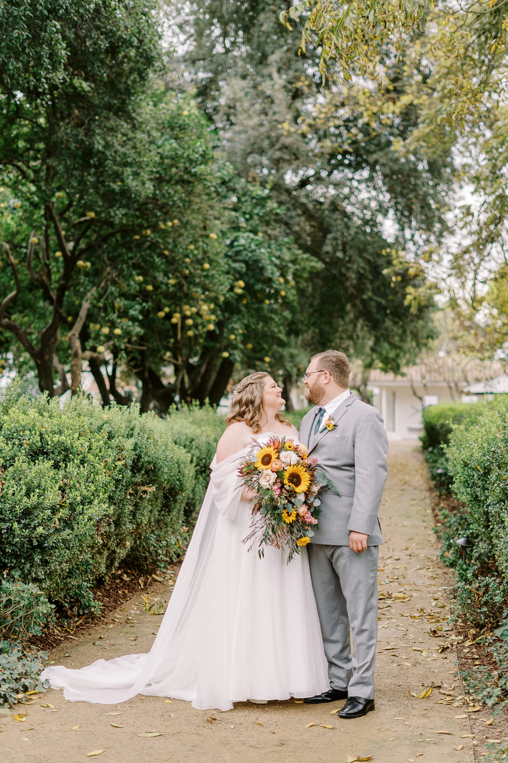 a bride and groom portrait in the trees at The Maples Woodland photographed by Sacramento wedding photographer