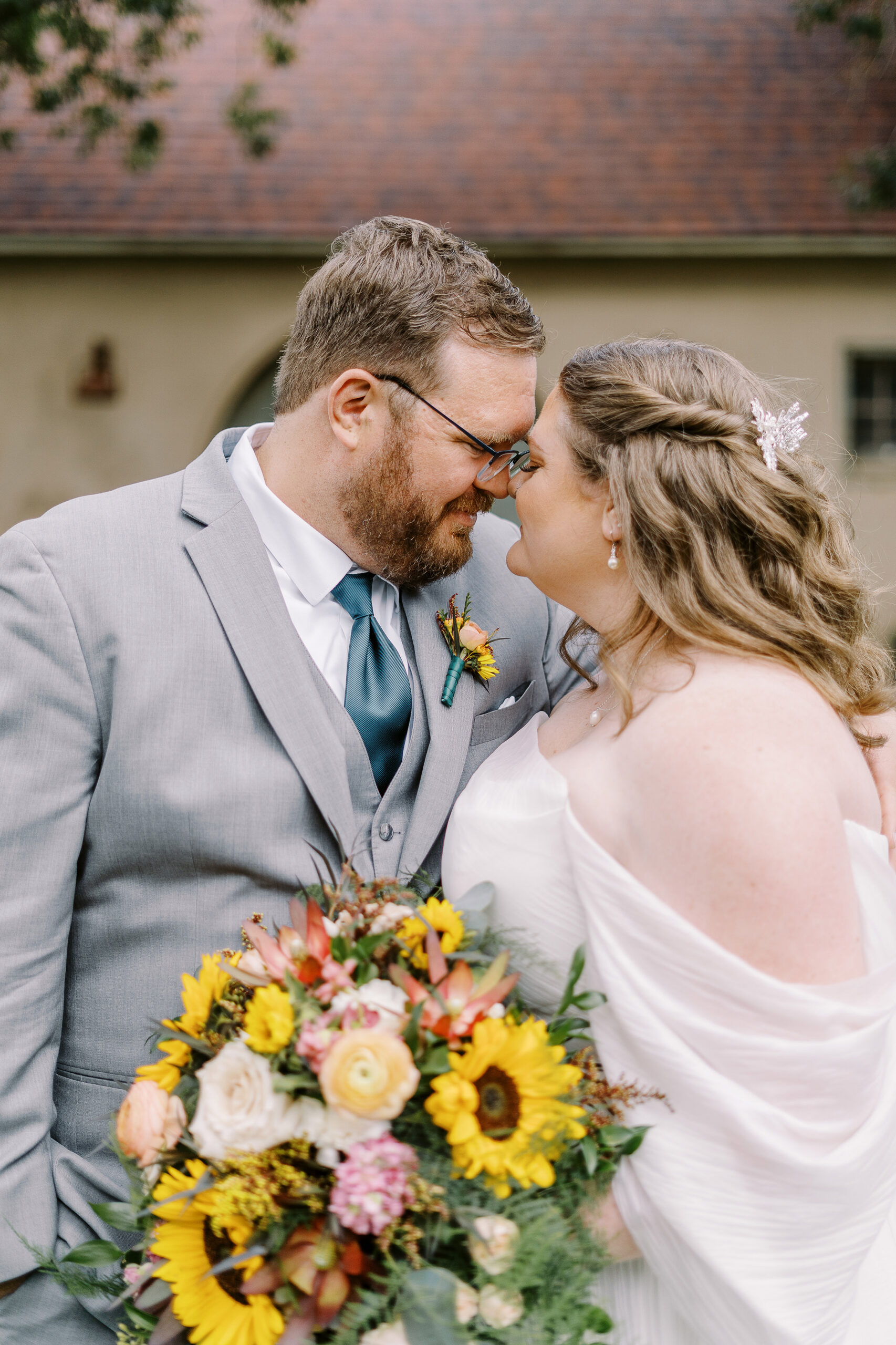 bride and groom portraits in front of the stables at The Maples Woodland photographed by Sacramento wedding photographer