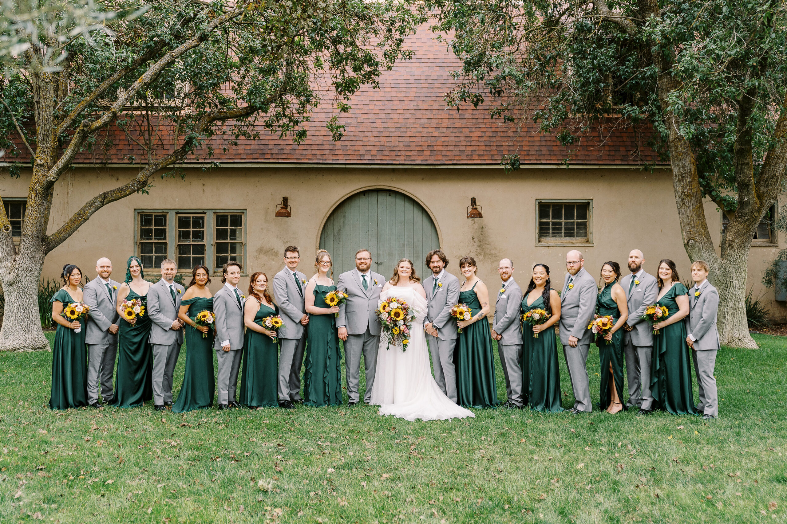 wedding party portraits in front of the stables at The Maples Woodland photographed by Sacramento wedding photographer