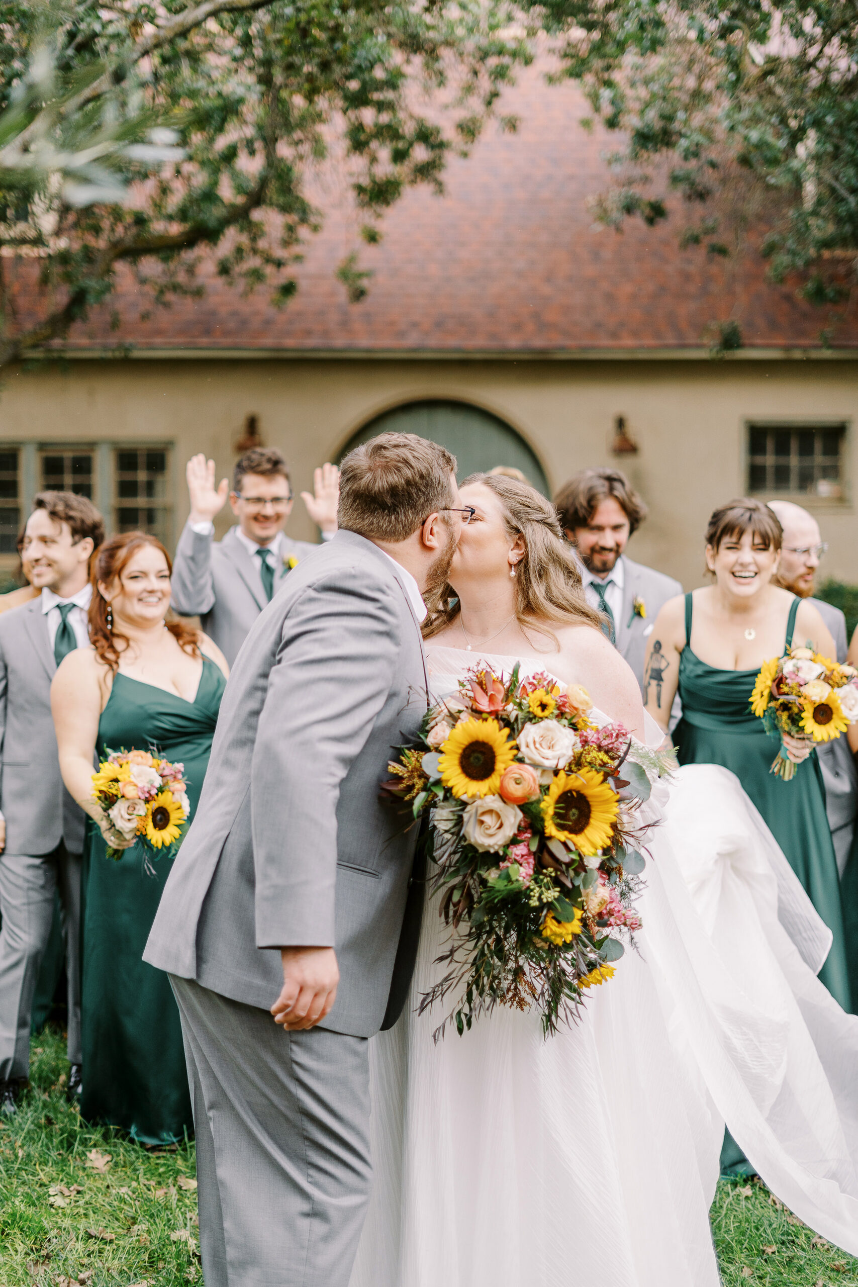 wedding party portraits in front of the stables at The Maples Woodland photographed by Sacramento wedding photographer