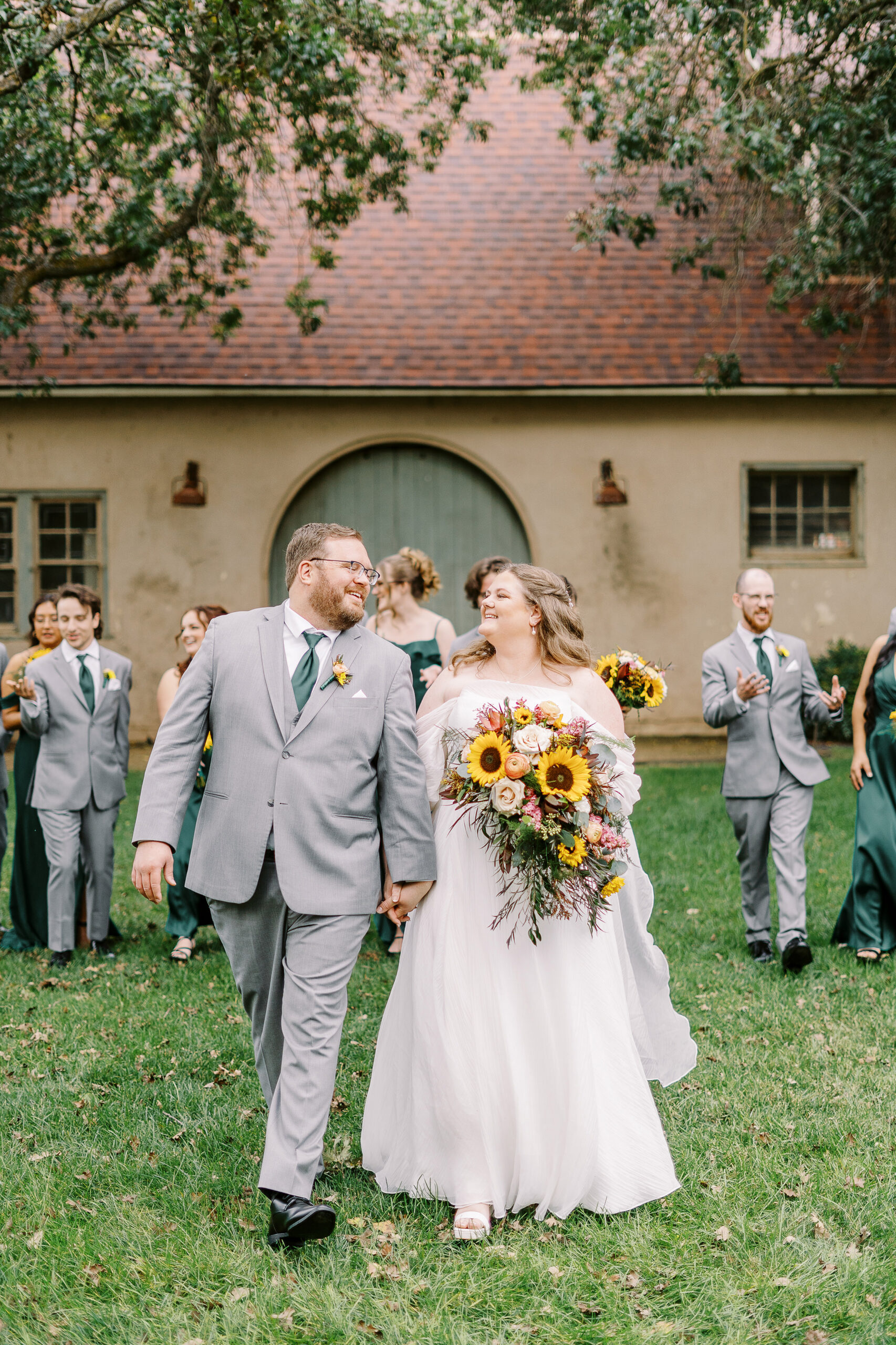 wedding party portraits in front of the stables at The Maples Woodland photographed by Sacramento wedding photographer
