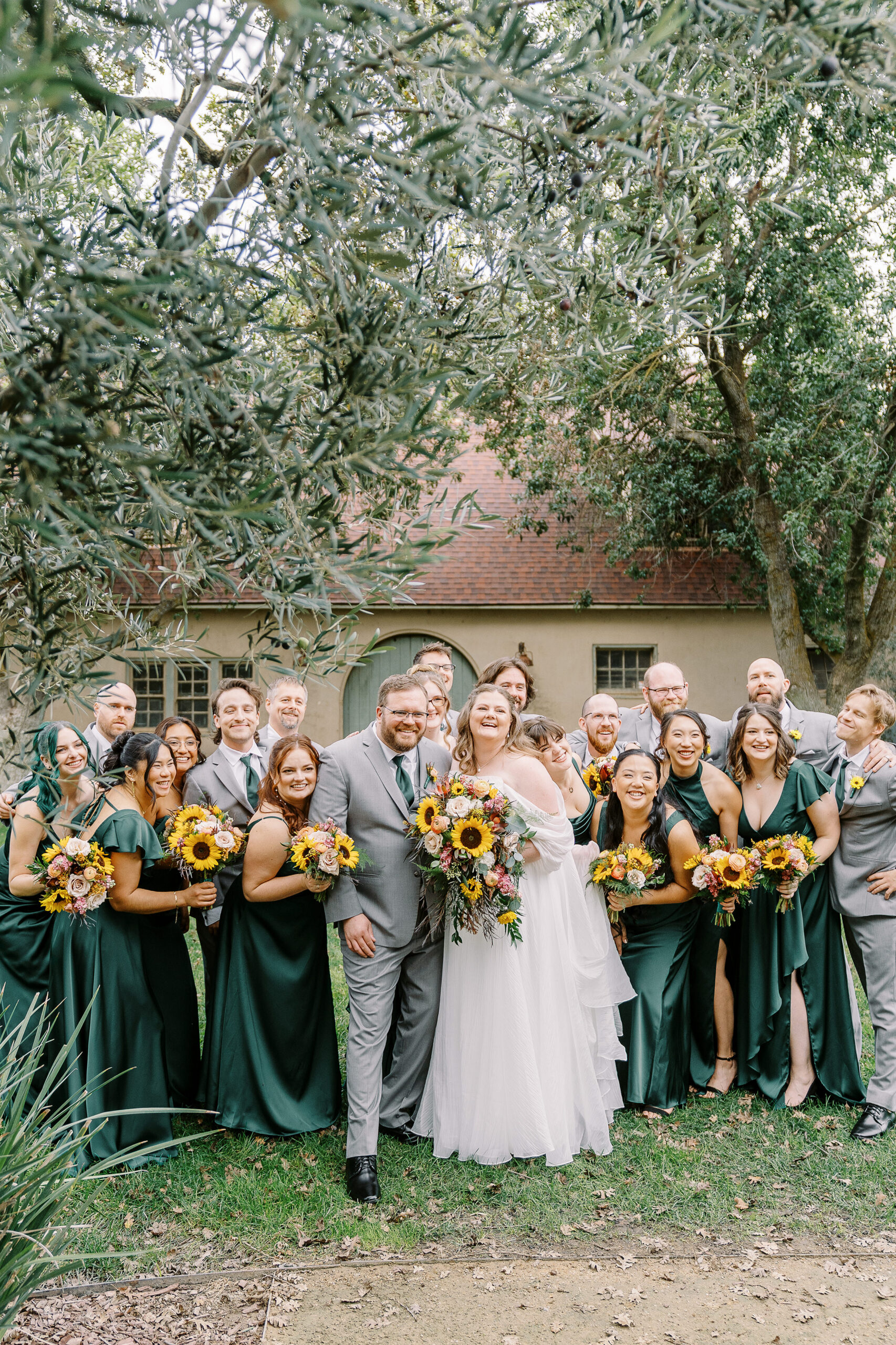 wedding party portraits in front of the stables at The Maples Woodland photographed by Sacramento wedding photographer