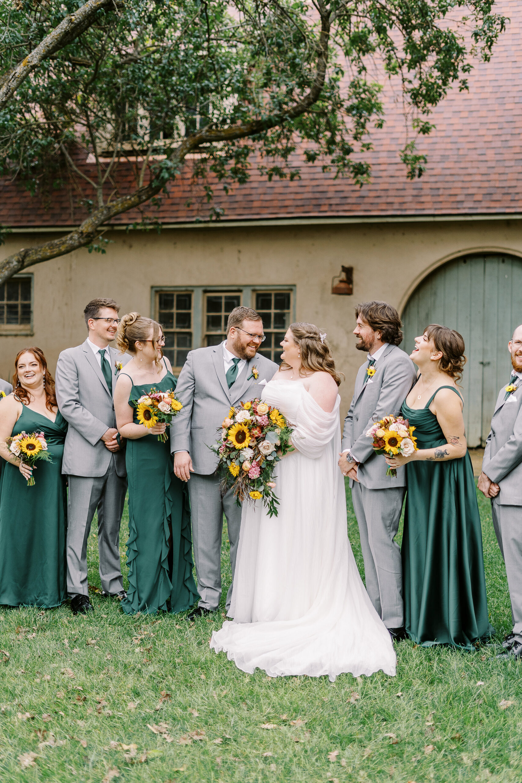 wedding party portraits in front of the stables at The Maples Woodland photographed by Sacramento wedding photographer