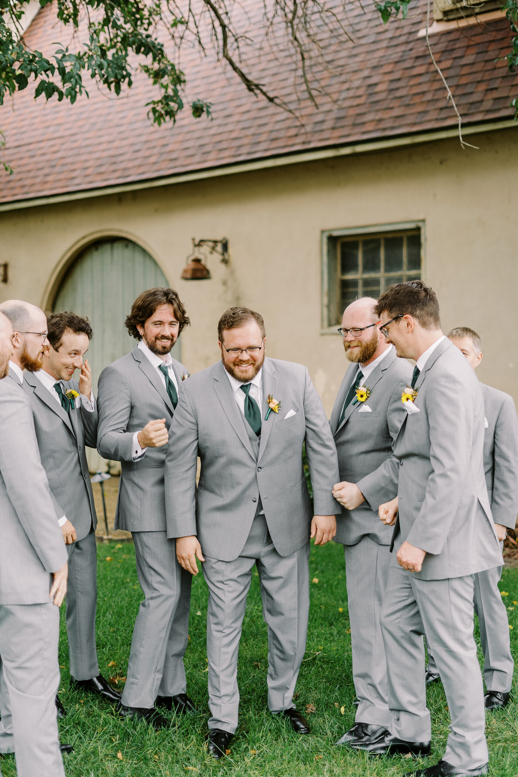 wedding party portraits in front of the stables at The Maples Woodland photographed by Sacramento wedding photographer