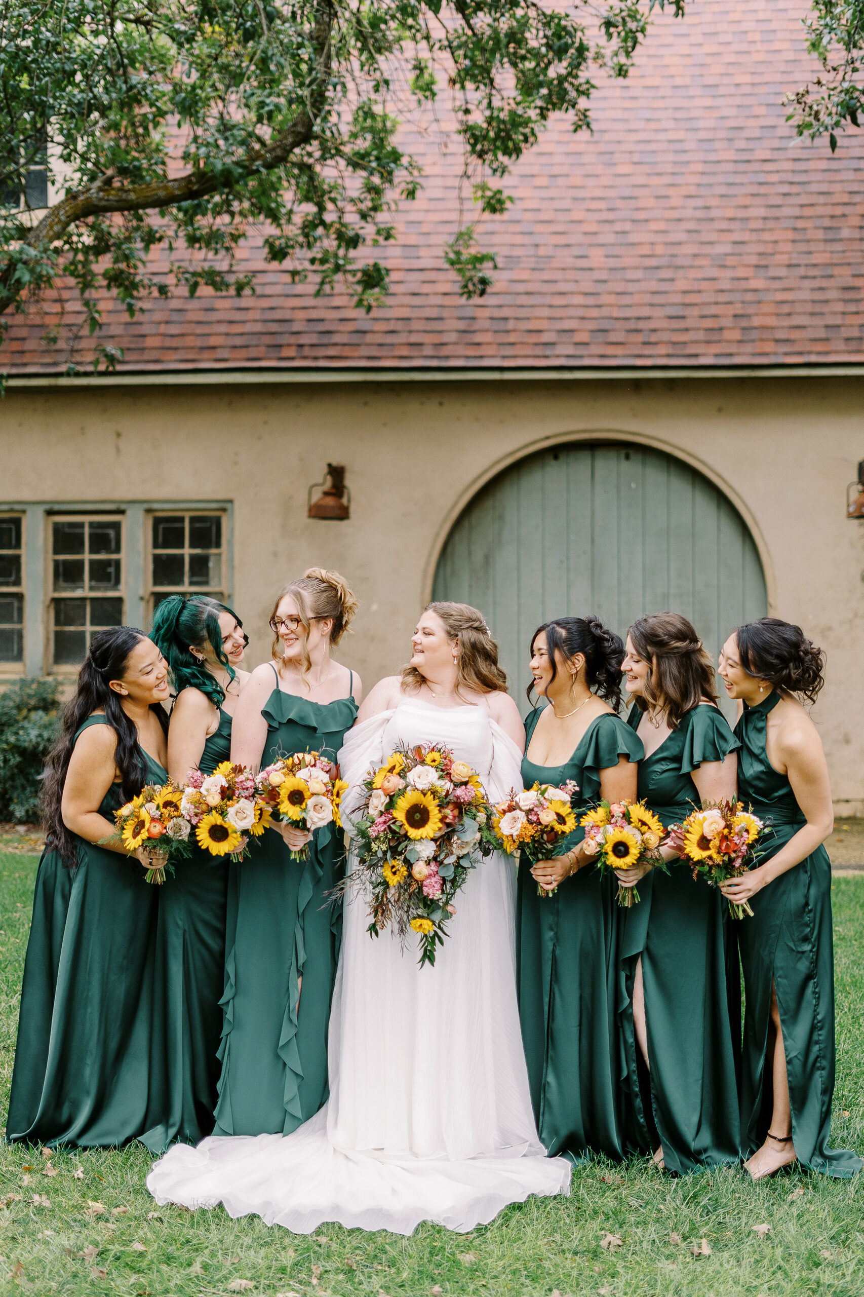 wedding party portraits in front of the stables at The Maples Woodland photographed by Sacramento wedding photographer