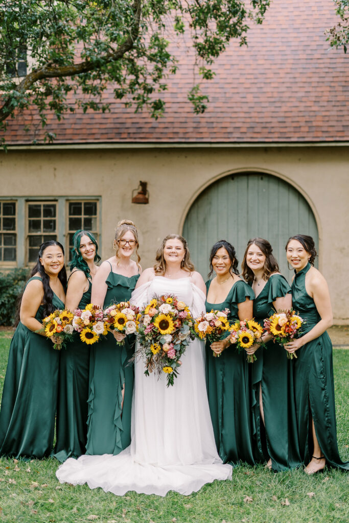 wedding party portraits in front of the stables at The Maples Woodland photographed by Sacramento wedding photographer