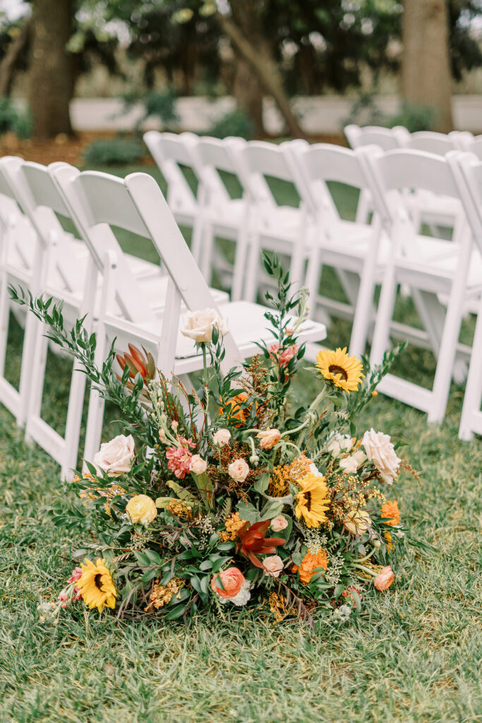 a wedding ceremony set up on the homestead main lawn at The Maples Woodland photographed by Sacramento wedding photographer