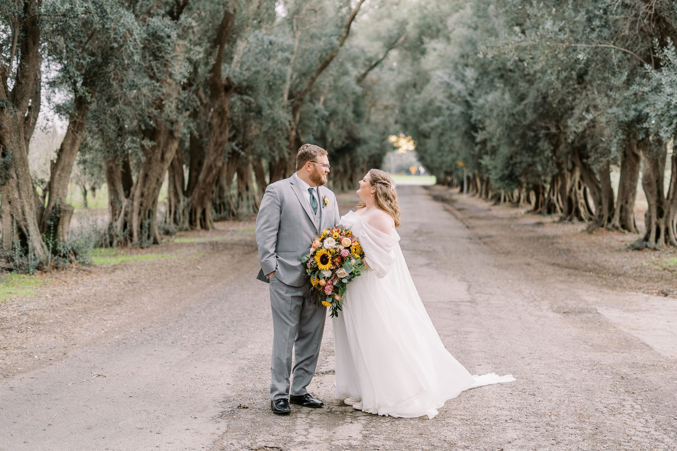 a bride and groom portrait in the trees at The Maples Woodland photographed by Sacramento wedding photographer