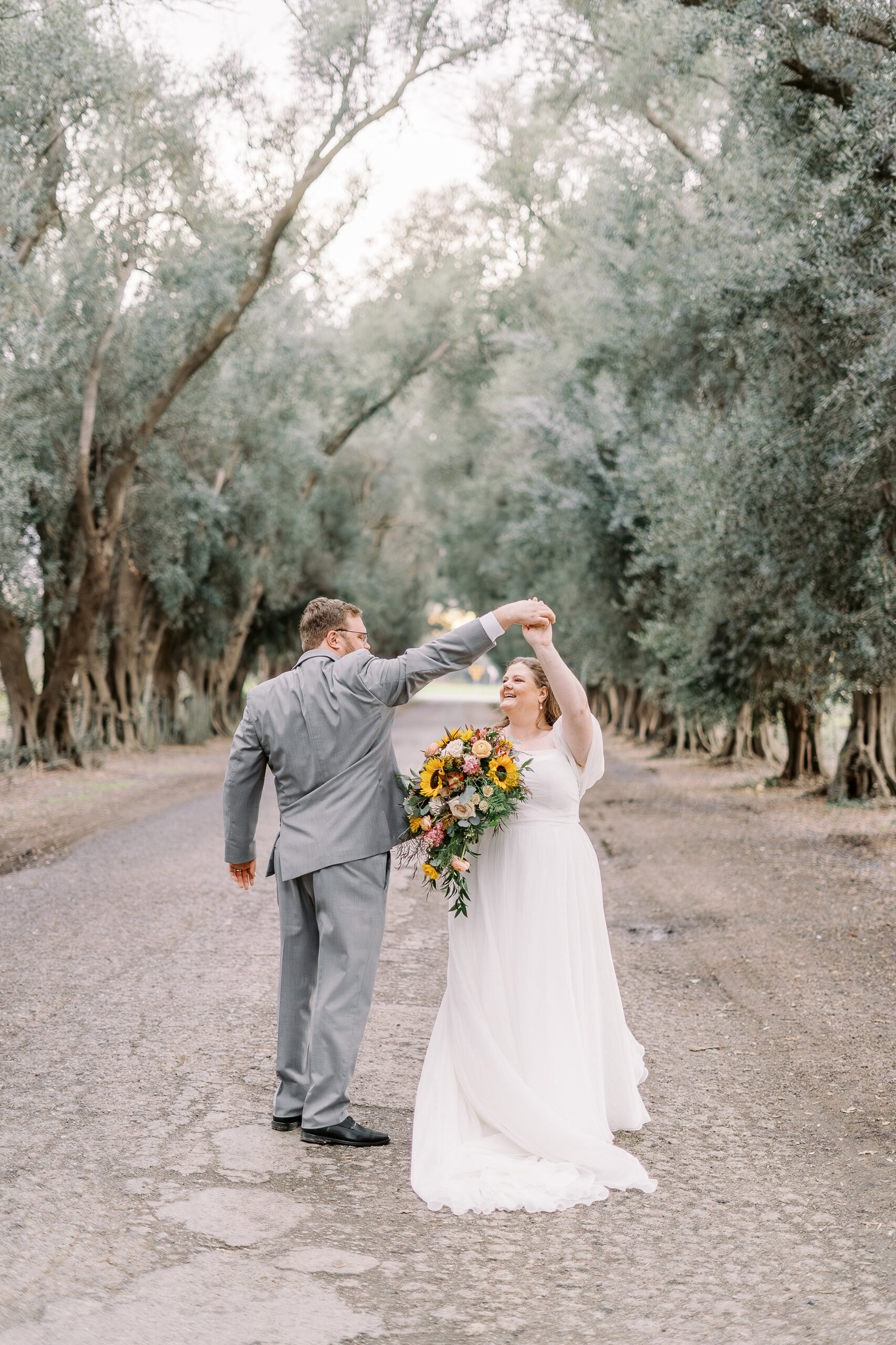 a bride and groom portrait in the trees at The Maples Woodland photographed by Sacramento wedding photographer