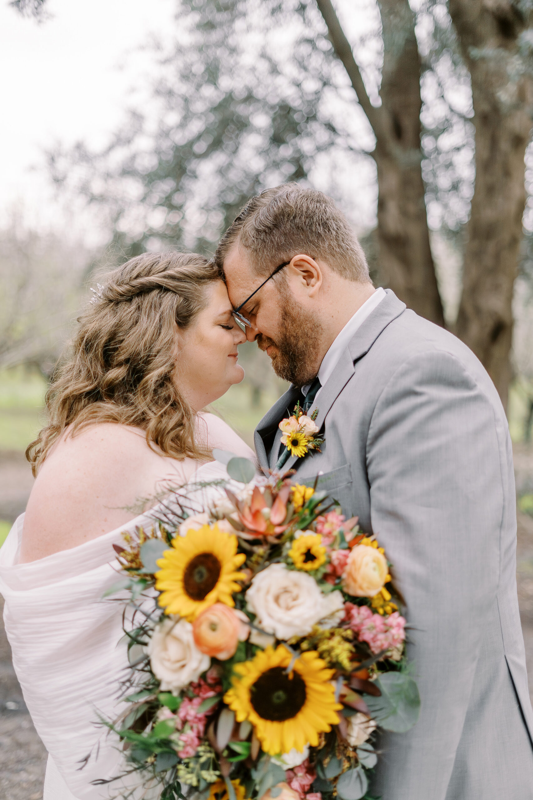 a bride and groom portrait in the trees at The Maples Woodland photographed by Sacramento wedding photographer